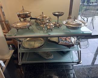 Large Collection of Silver Plate on Tempered Glass 3 Tiered Entertainment Stand (44"W x 24"D x 22"H)