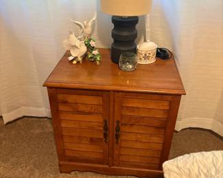 . . . a nice shutter-style maple night stand with lamp and doves