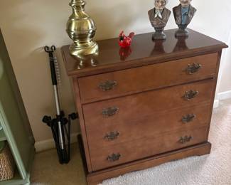 . . . brass lamp, cardinal and figures on maple chest of drawers