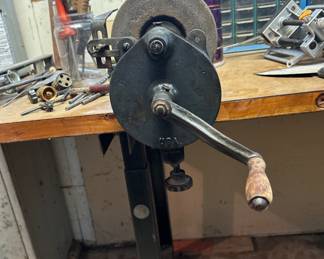 Hand crank grinding wheel.