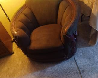 Barrel chair. Neat wood trim.
