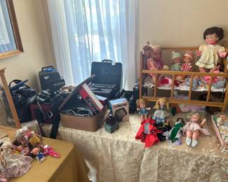 Cameras, dolls etc