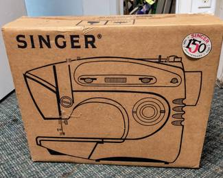 New never opened Singer sewing machine