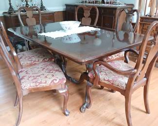 Dining table with 6 upholstered dining chairs. 2 captain's.