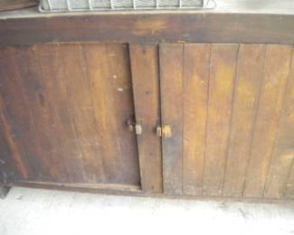 Primitive wooden hand made kitchen cupboard