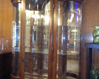 One of 2 beautiful lighted curio/display cabinets