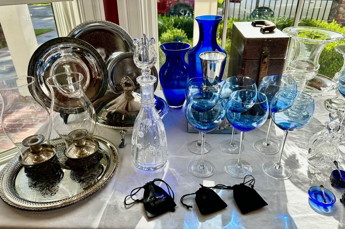 We have two sets with 6 glasses each (total available 12) of Lenox Gems blue balloon wine glasses 9” high.