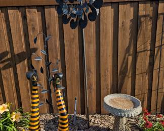 Halloween witches legs, concrete birdbath, Wind turbine