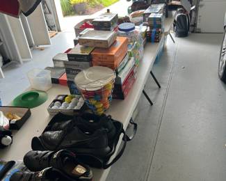 Garage filled with car, cleaning items, generator, tools,
