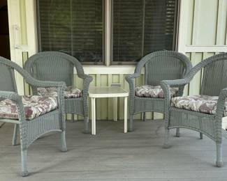 4 gray whicker chairs and small table