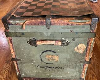 antique foot locker with leather chess board on top