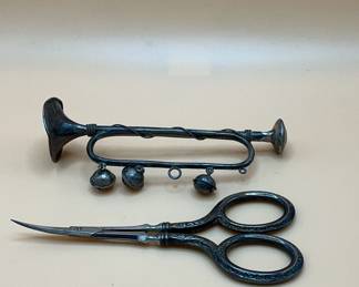 antique embroidery scissors and silver trmpet rattle