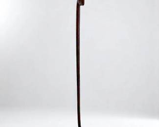 An Oceanic Carved Hardwood Carrying Rod Inlaid W/ Obsidian Eyes