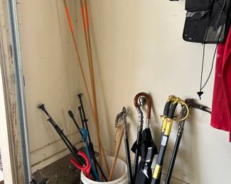 Blow dart guns, skeet thrower, swords, umbrella/swords