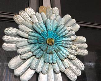 Metal flower wall decor outside