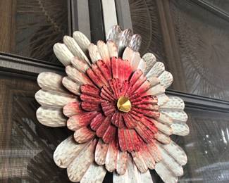 Metal flower wall decor outside