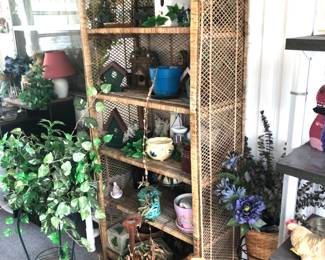 Porch wicker etagere. Silk florals, light houses, bird houses, baskets.