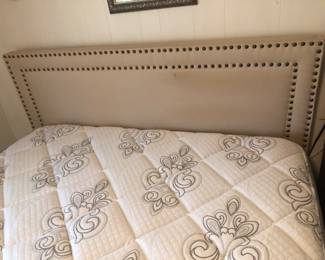 Queen mattress and foundation. Padded headboard with brass nailheads.