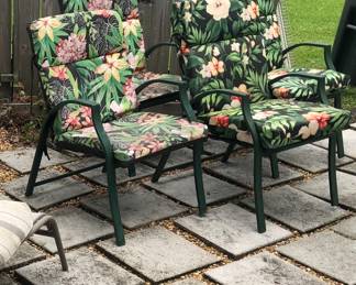Metal lawn chairs with tropical floral print.