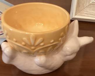 Ceremic bunny holding yellow bowl