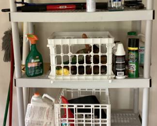 White plastic shelves with cleaning supplies