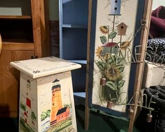Lighthouse plant stand and tall artistic bird feeder storage cabinet