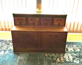 Multi wood smaller two-surface unit with 4 'file' drawers and 4 lower drawers - a family room could use for sure. 