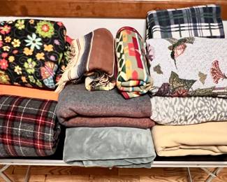 11 quilts and flannel and woven blankets for everyone's liking