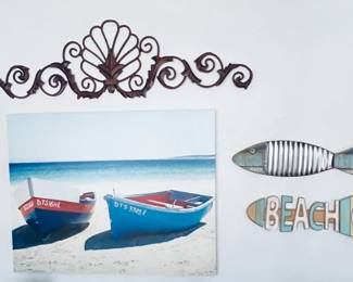All three available. Scrolling metal hanging (18inches) Two rowboats beachside and Two out of the water fish
