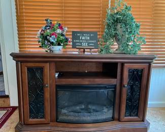 Fireside made easy with electric remote control! Glass covered shelving adds greater functionality (approx 72x30) 