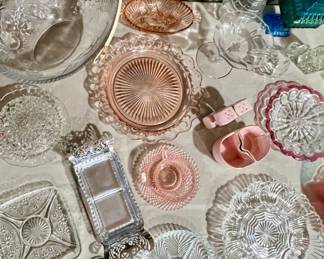 Glass platters bowls and a pink salt and pepper shaker with creamer and sugar bowl, and a heart to hang