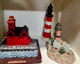 Collection of many lighthouse figurines 