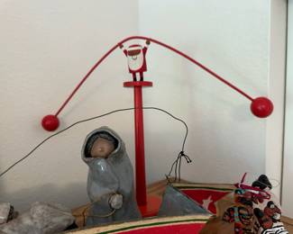 Clay Sculpture of Mother Pulling Baby on Sled