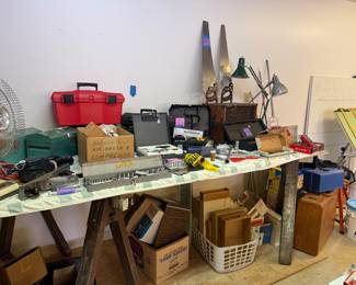 Metal tool boxes, saws, fishing gear (rods, reels and lures). 