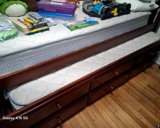 Two Trundle Beds, One Dark Wood, Second White