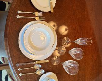 $500 for all, willing to split/break. 
China and crystal set of 12 of: 
Red wine glass
White wine glass 
Champagne glass
Coffee cup and saucer 
Salad bowl
Bread plate 
Dinner plate 
Salad fork
Dinner fork
Dinner knife 
Bread knife 
Soup spoon
Teaspoon
Not pictured:
Serving bowls, platter, and utensils
Butter dish, sugar dish, gravy boat, and salt + pepper shaker 
Christmas butter knives, butter dish, and sugar dish 