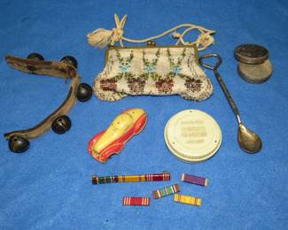 Lot 214. Collectible smalls including a very old rubber car, WW2 service ribbons, advertising pieces, and more