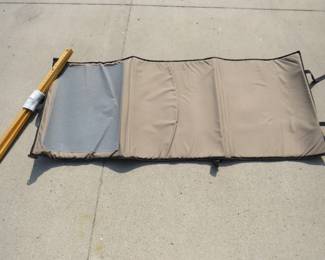 Lot 180. Roll-out shooting mat 64" x 28" and a set of shooting sticks