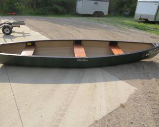 Lot 426. 15' Old Town Discovery Sport square stern canoe. Three seats. Very good condition. Polyethylene construction. The trailer is in lot 429