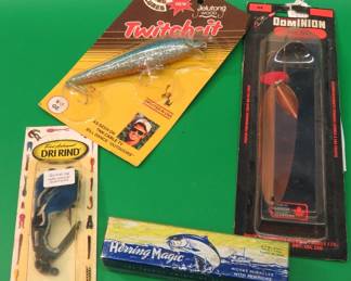 Lot 78. NIP Strike King 4 1/2" Twitch-It, NIP Owen's Dominon 4" Sail Fish, NIP Fred Arbogast Dri Rind, and a Herring Magic in the box with box