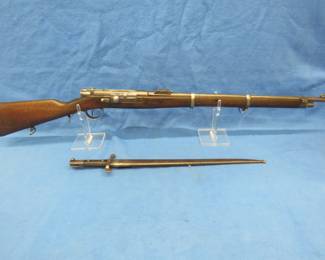 Lot 302. 1886 Steyr Kropatschek 8mm bolt-action rifle with bayonet. SN A665. Matching serial numbers. Very good condition. Ammo for this gun is in lot # 390.