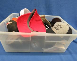 Lot 263. Tote with many like-new and some new with tags baseball hats