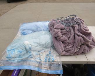 Lot 353. Electric blanket and bedding is a vacuum bag.