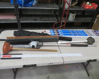 Lot 225. Long-handled items including the business end only of a Milwaukee pole saw, Rapala fish ruler, T8 light bulbs, and more
