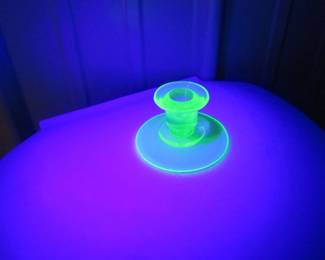 Lot 101. Three pieces of uranium glass including a large flower frog