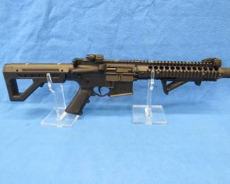 Lot 181. DPMS Panther Arms SBR full auto CO2 BB gun. New in the box with over 7000 BB's and 40 CO2 cartridges.