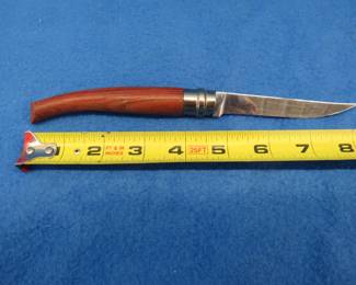 Lot 111. 10 centimeter (just under 4") Opinel folding fillet knife with sheath. Made in France and in very good condition.