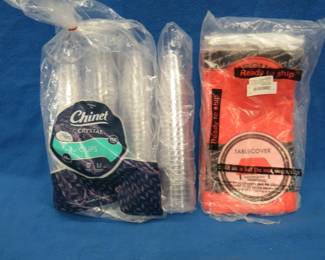 Lot 289. Over 100 disposable 10-ounce cups and 8 plastic tablecloths