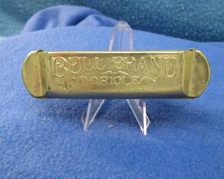 Lot 88. National Musical String Co. Bell Brand Oriole diatonic harmonica in the key of F.
