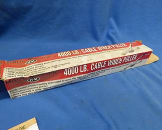 Lot 428. 4000 lb. cable winch puller, appears unused
